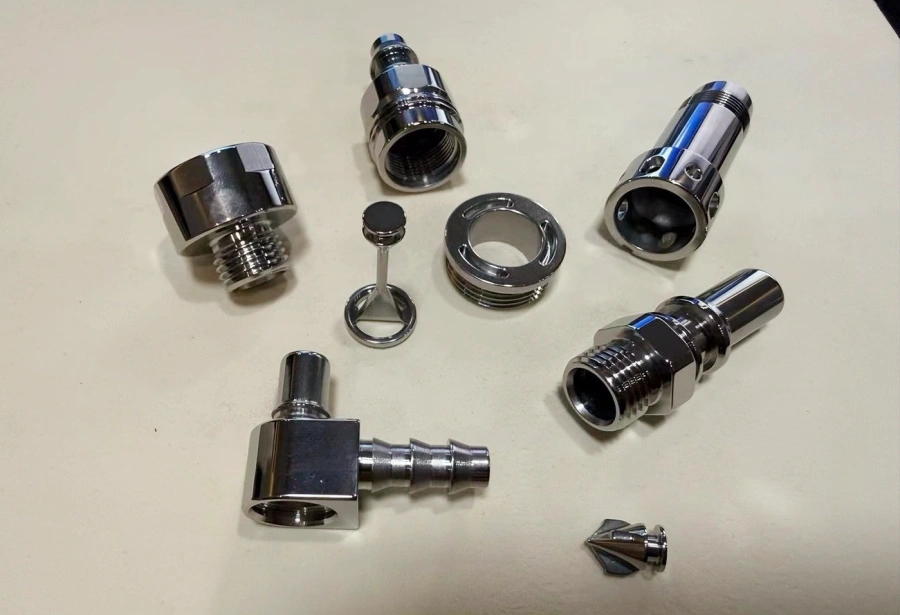 Internal cross-hole deburring process for liquid cooling fittings