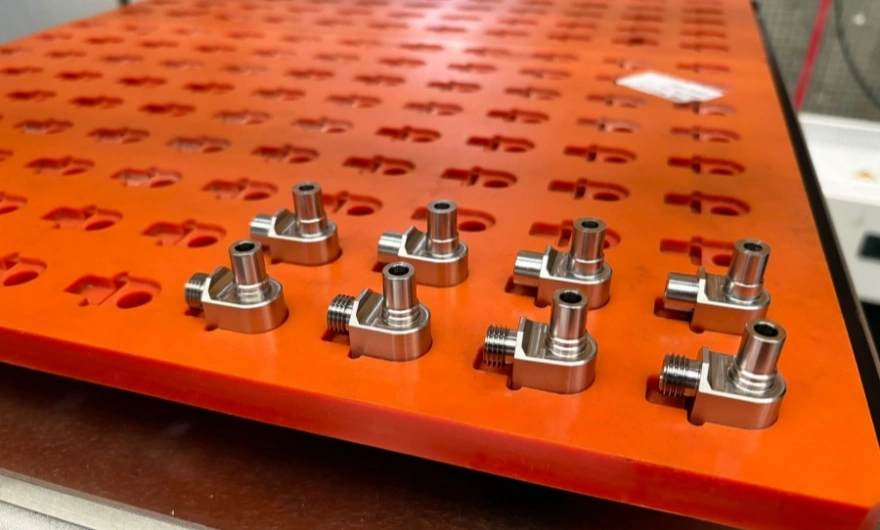 Internal cross-hole deburring process for liquid cooling fittings