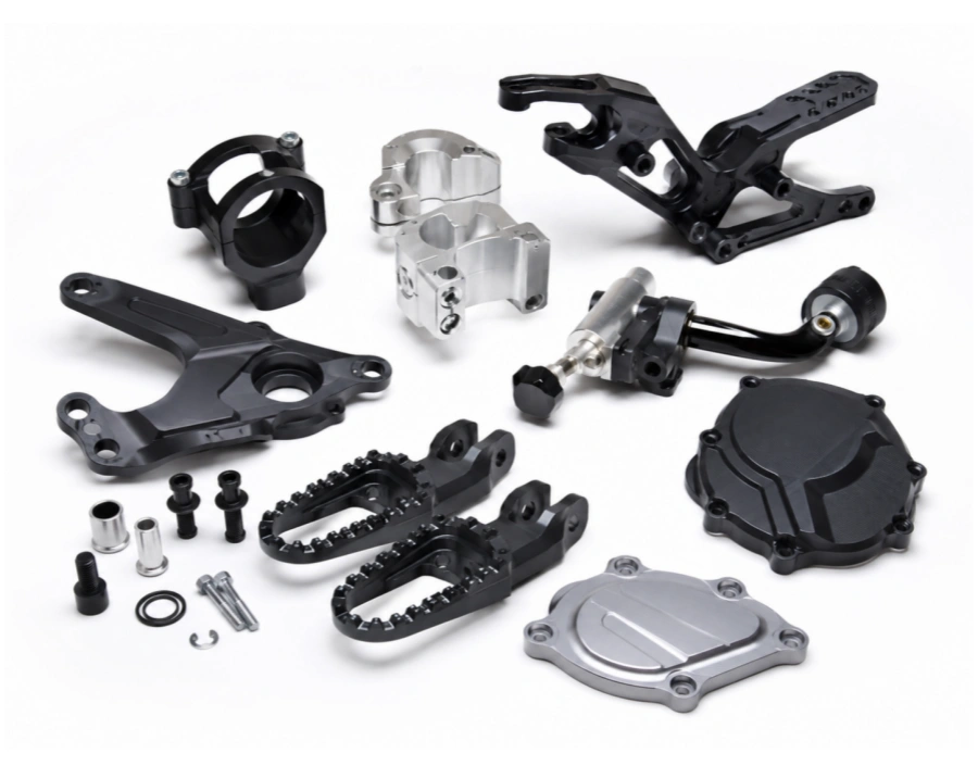 CNC machined motorcycle components including aluminum brackets clamps and performance hardware